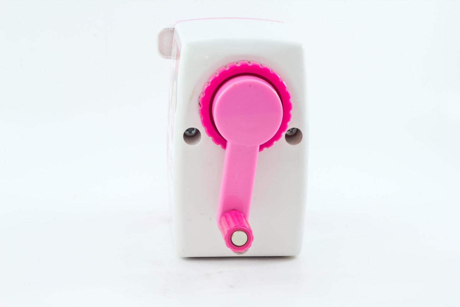 Mechanical sharpener of pencil on the white background photo