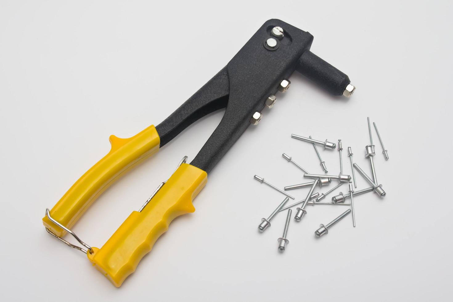 riveters and rivets on white background photo