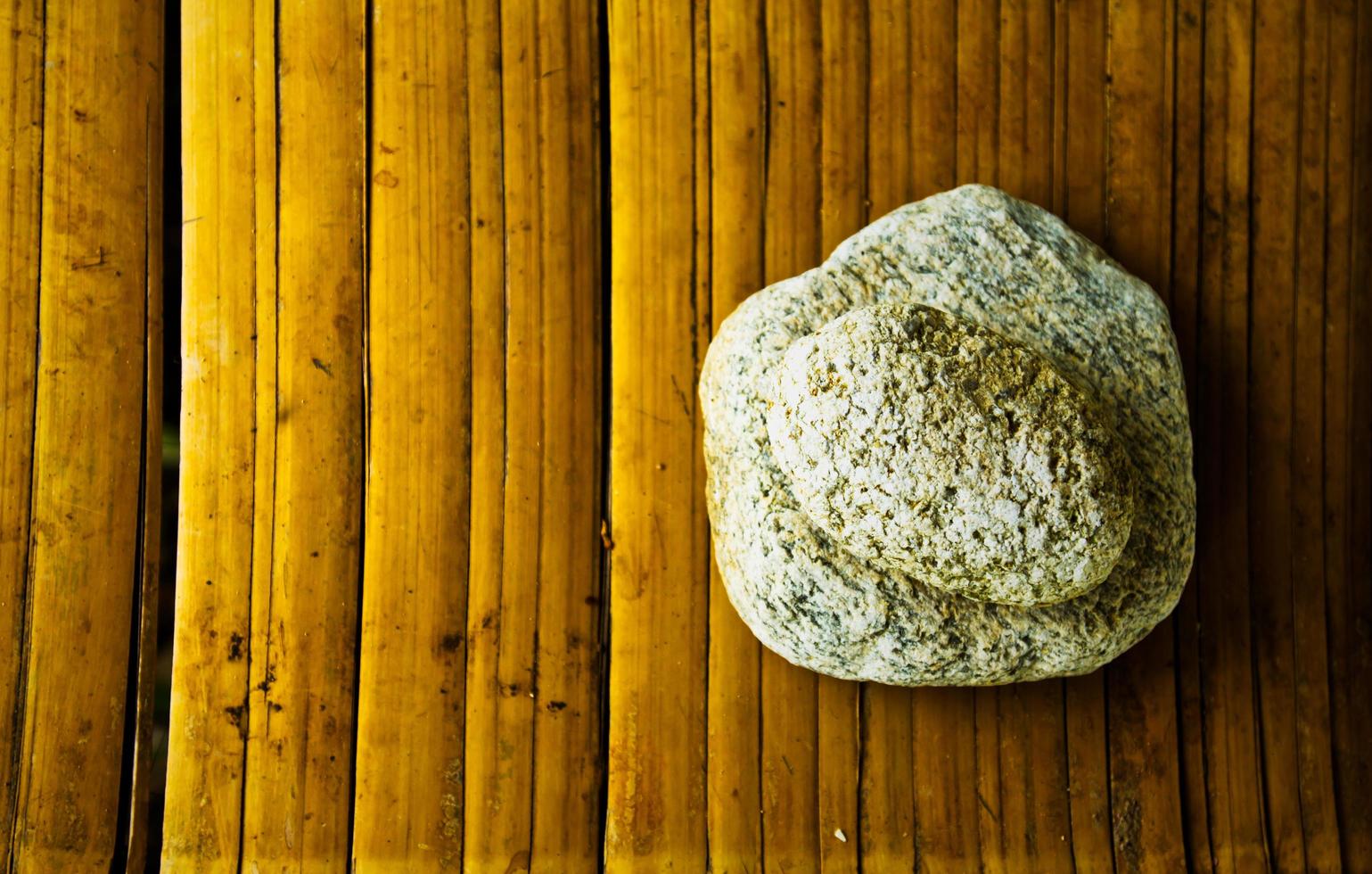 rocks on bammboo mat photo
