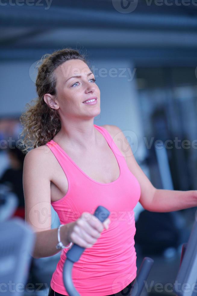 woman exercising on treadmill in gym photo