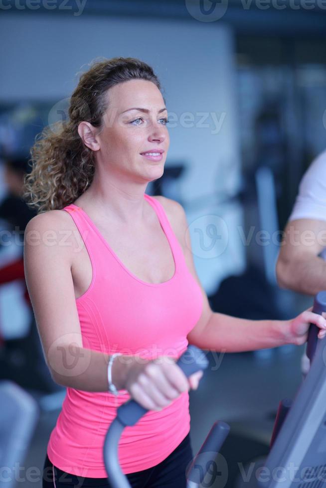 woman exercising on treadmill in gym photo