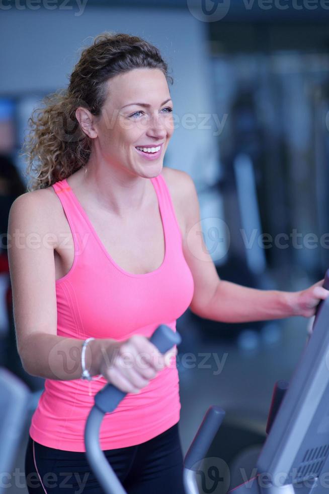 woman exercising on treadmill in gym photo