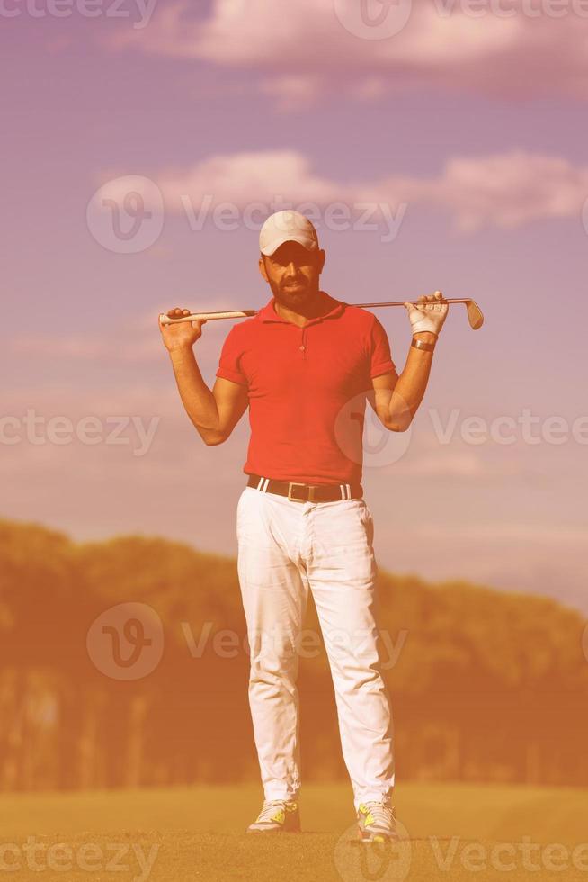 handsome middle eastern golf player portrait at course photo