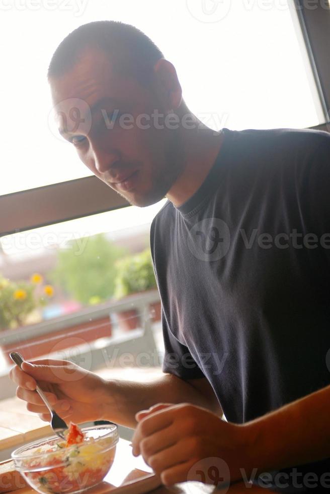 man eating healthy food it an restaurant photo