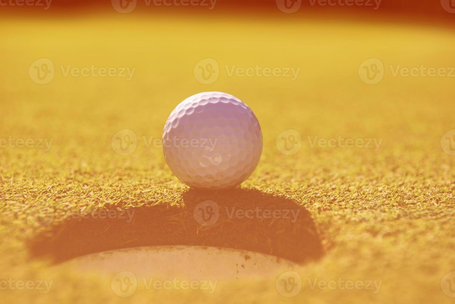 golf ball in the hole photo