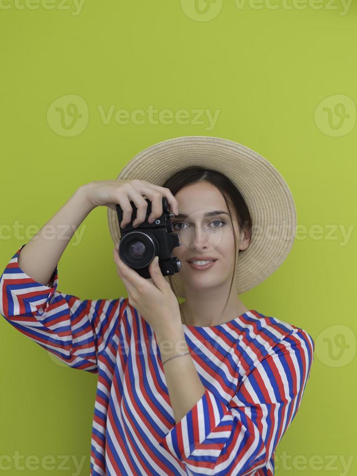 Portrait of beautiful female photographer shooting close up photo