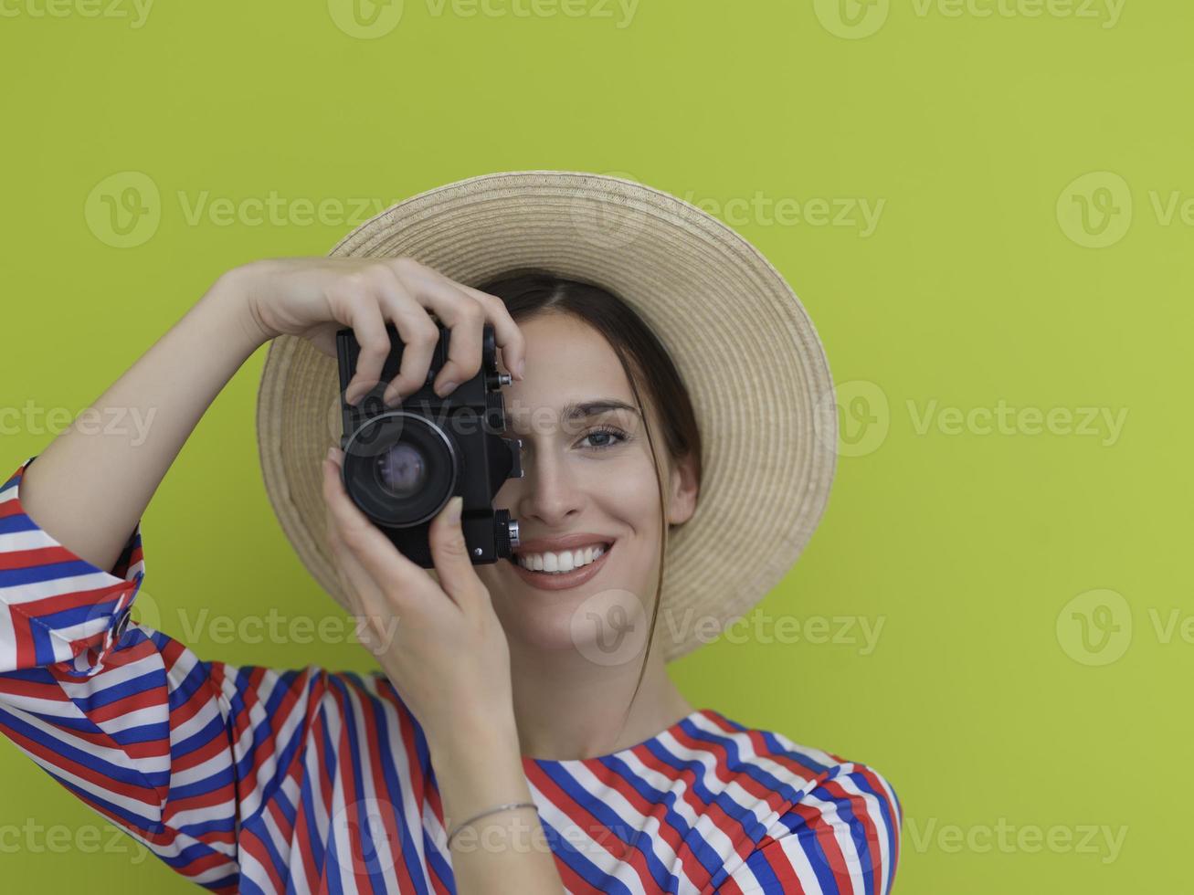 Portrait of beautiful female photographer shooting close up photo