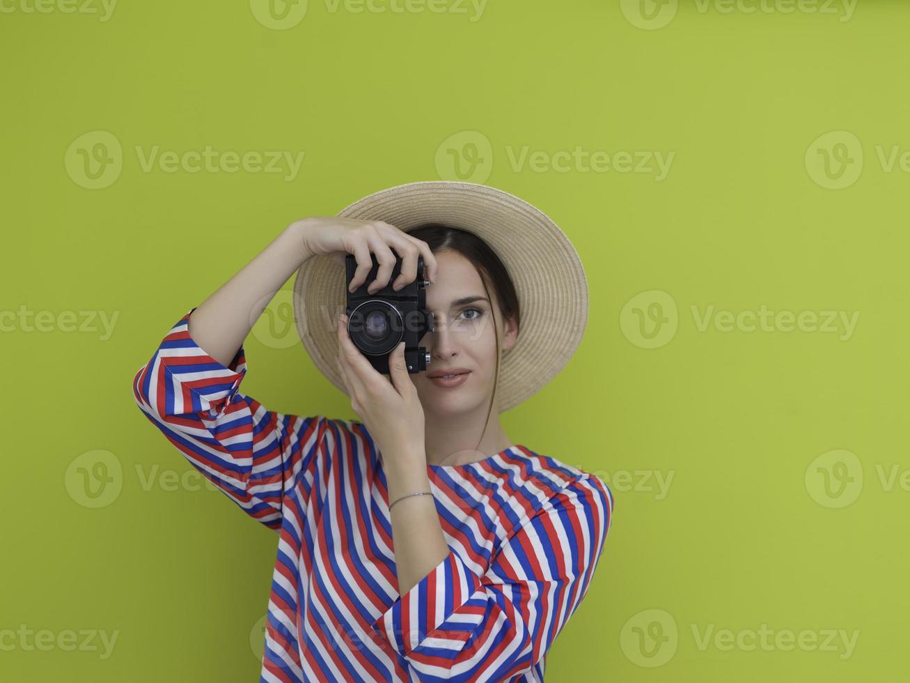 Portrait of beautiful female photographer shooting close up photo