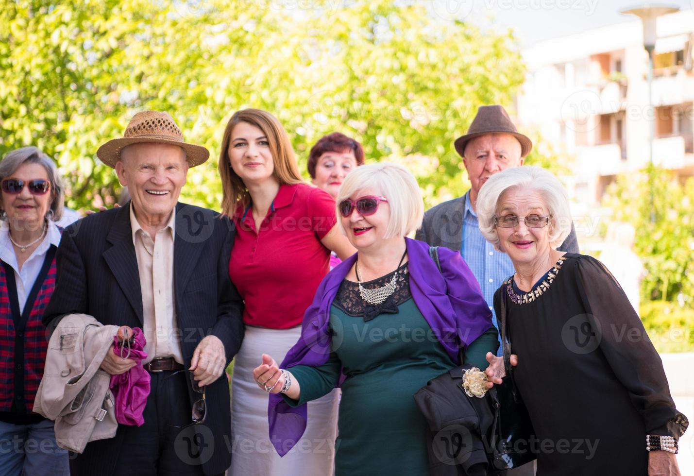 group portrait of senior people with geriatric nurse photo