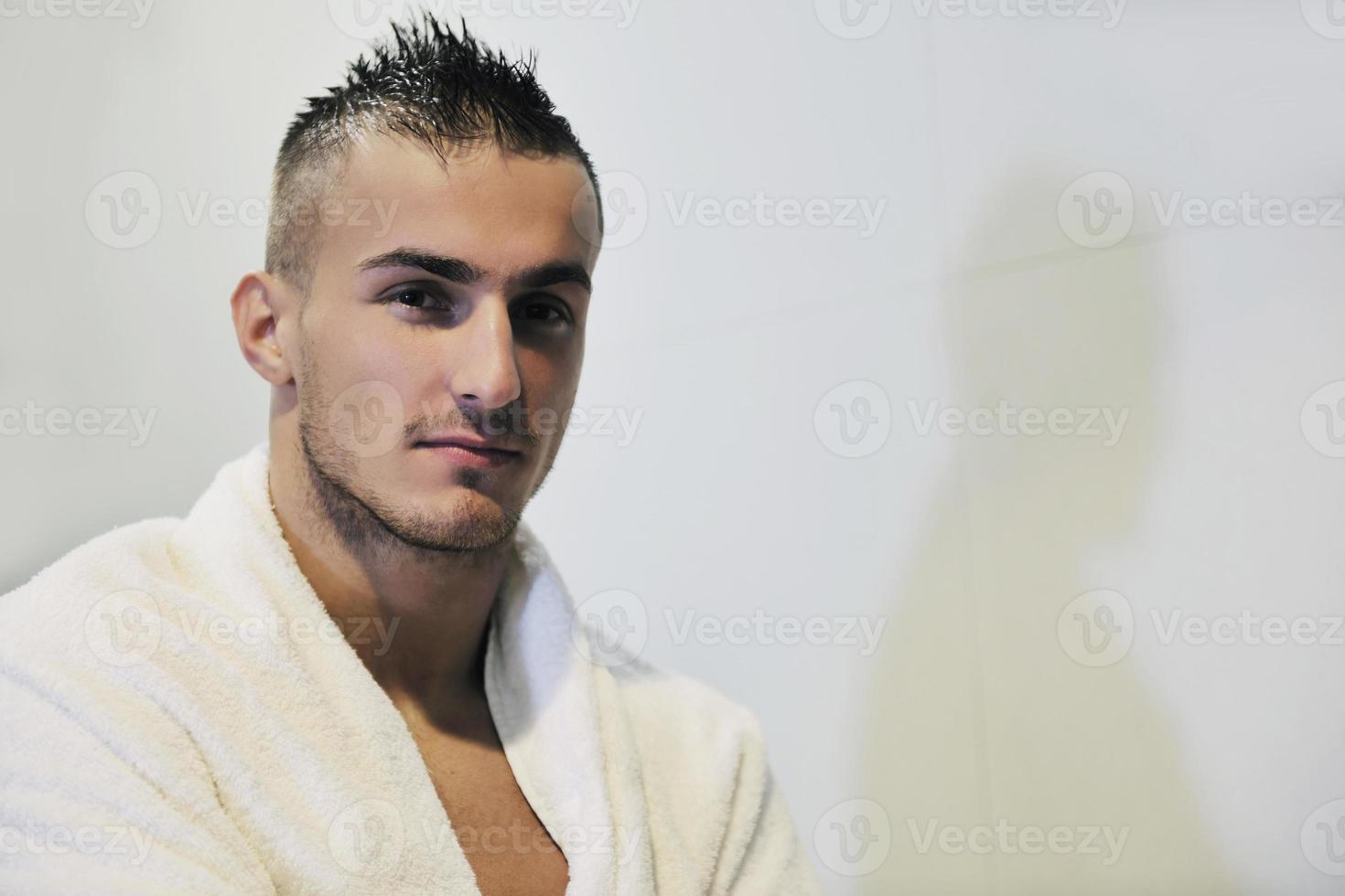 good looking man under man shower photo