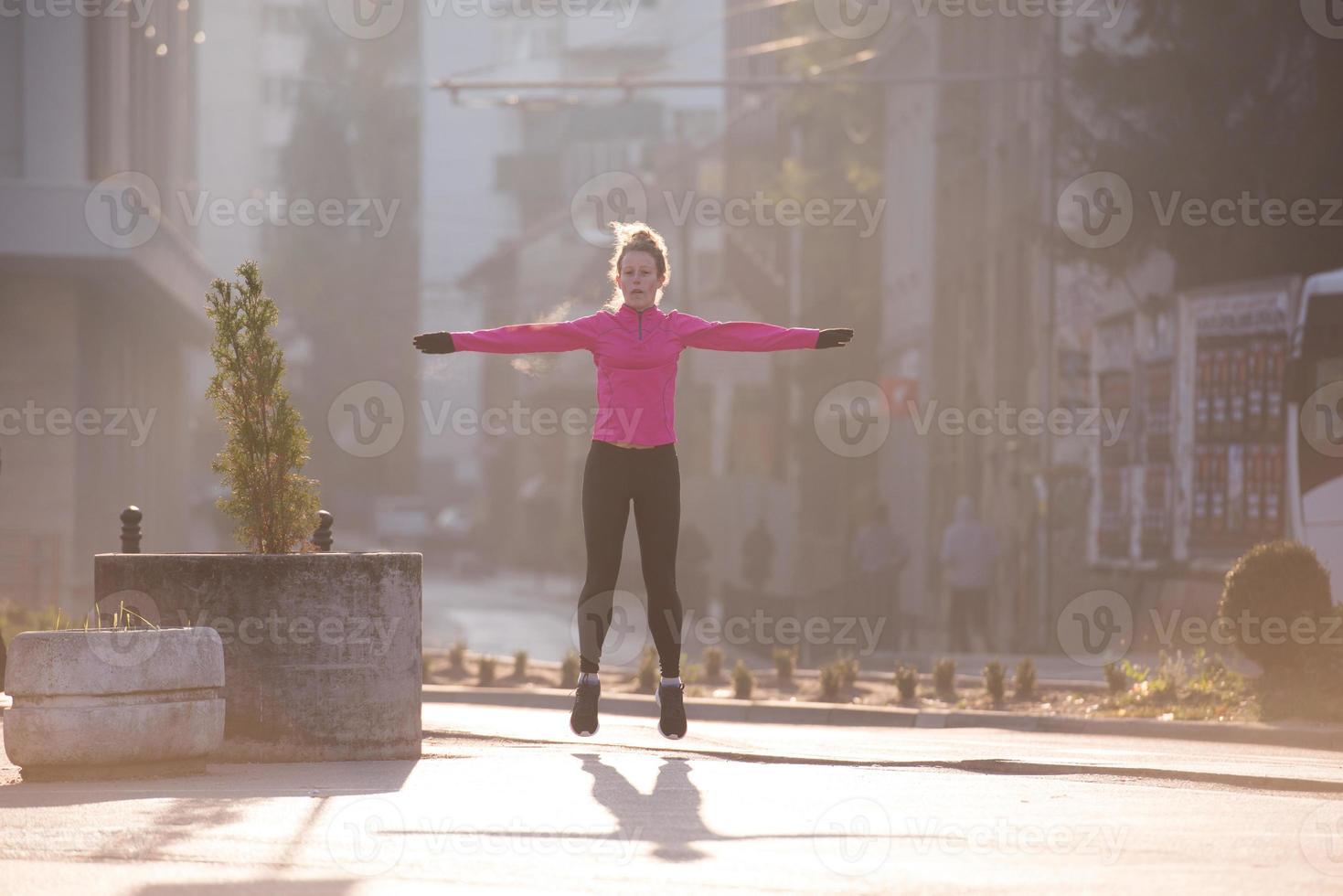 woman  stretching before morning jogging photo