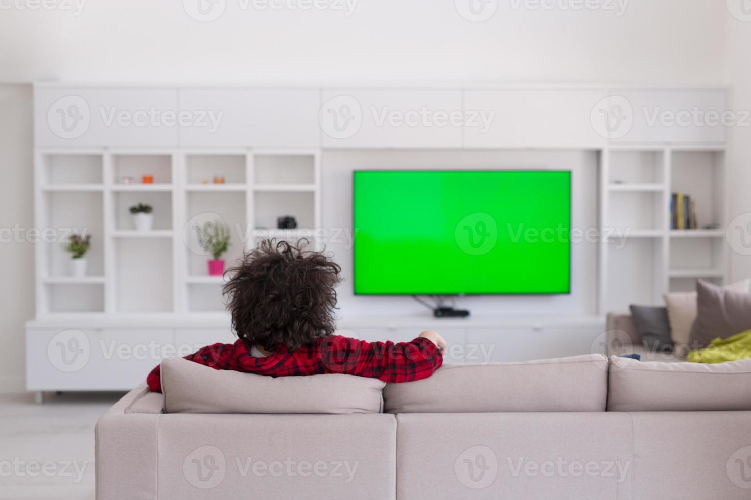 young man in bathrobe enjoying free time photo