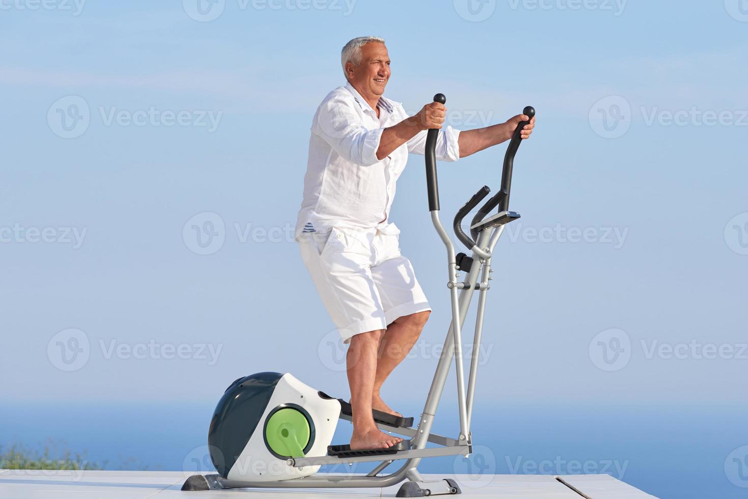 healthy senior man working out photo