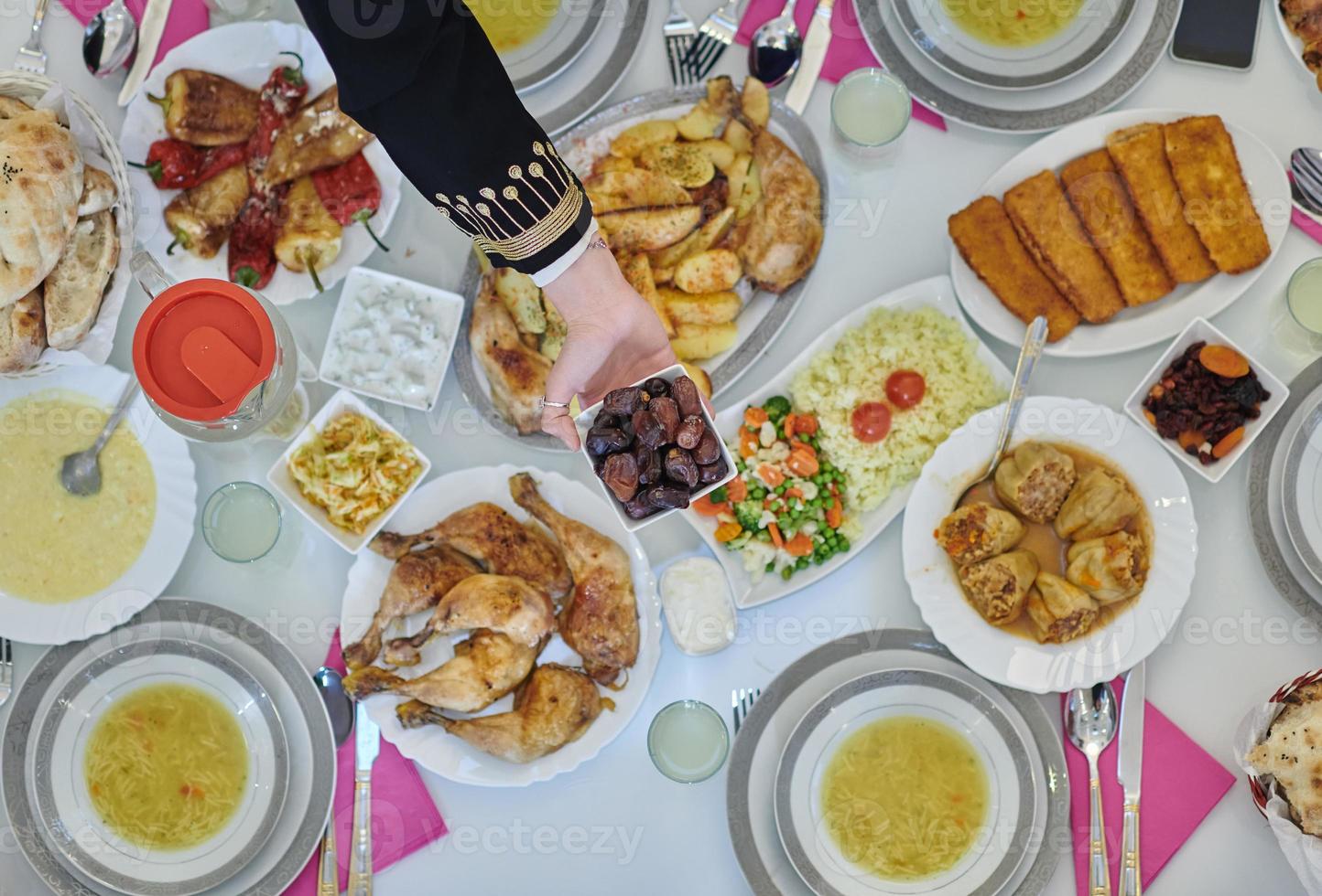 Top view of muslim family having Iftar during Ramadan holy month photo