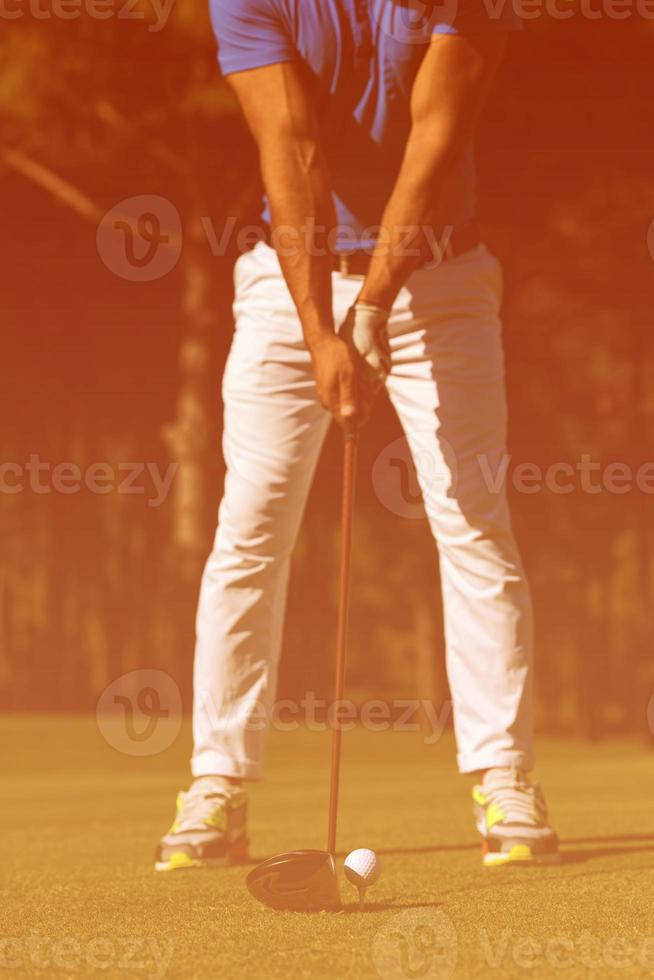 golf player hitting shot photo