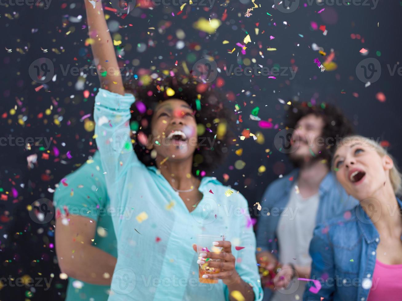 confetti party multiethnic group of people isolated over gray photo