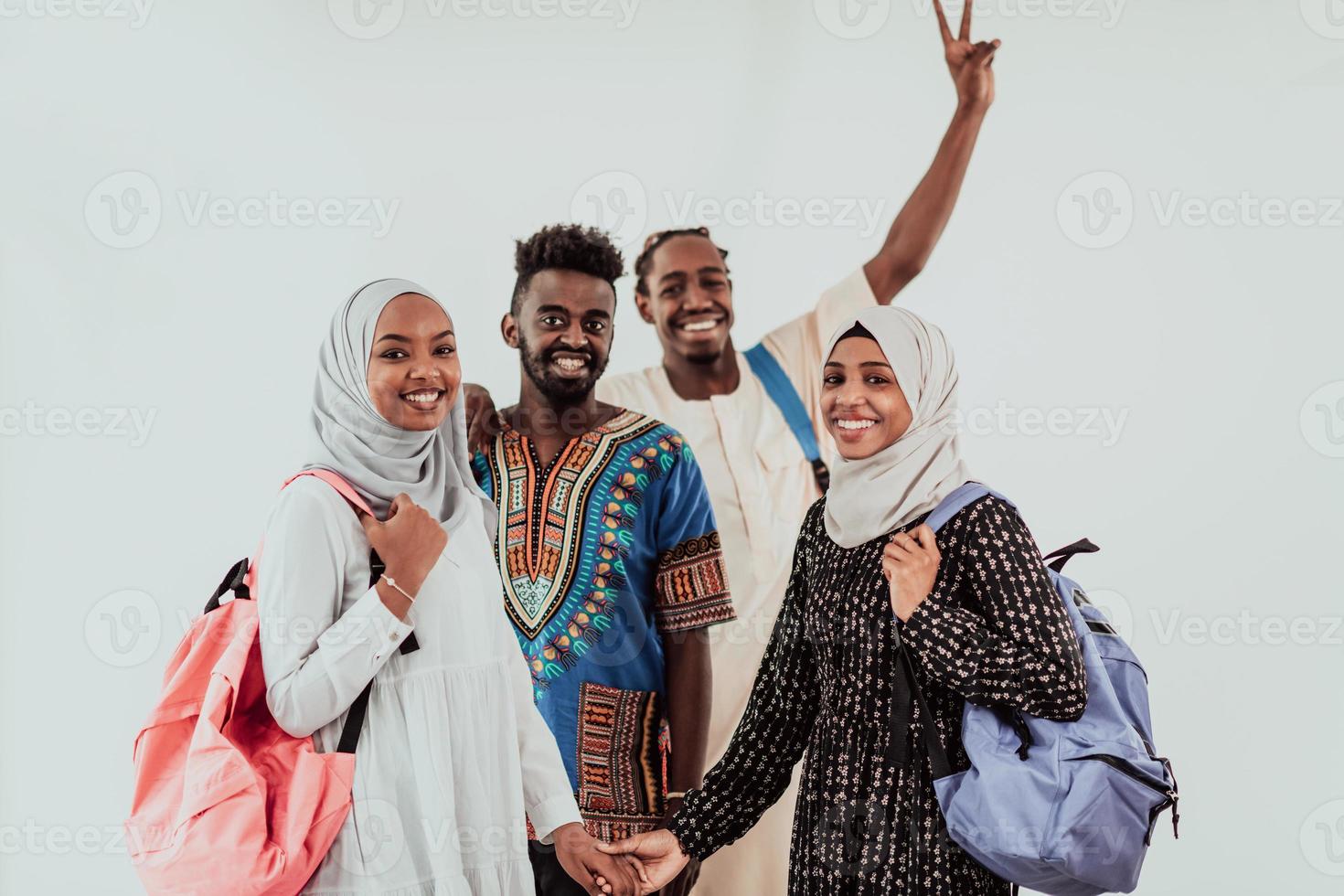 Group of happy african students having conversation and team meeting working together on homework girls wearing traidiional sudan muslim hijab fashion photo