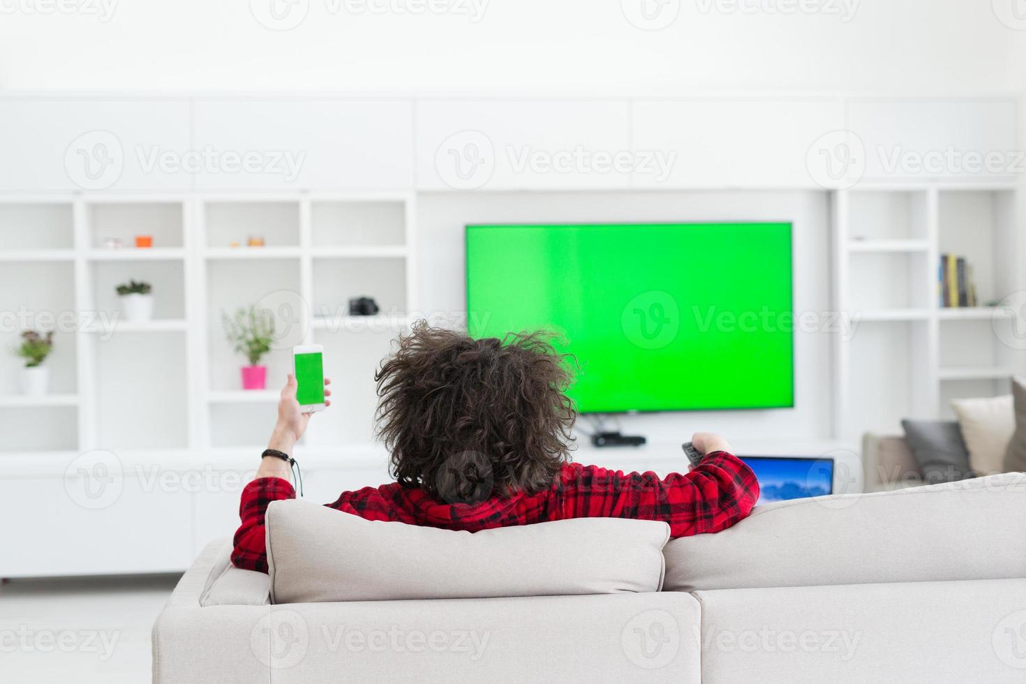 young man in bathrobe enjoying free time photo