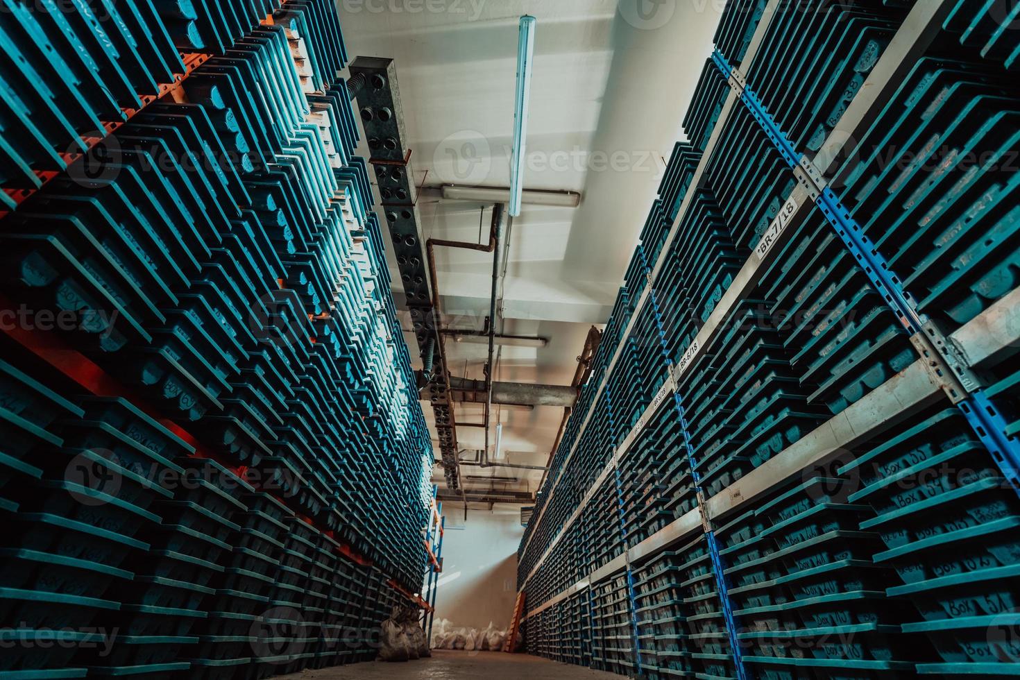 Gold mining storage rock core samples geology drilling industy. Large ore warehouse in modern industry, ores stacked in boxes. Selective focus photo