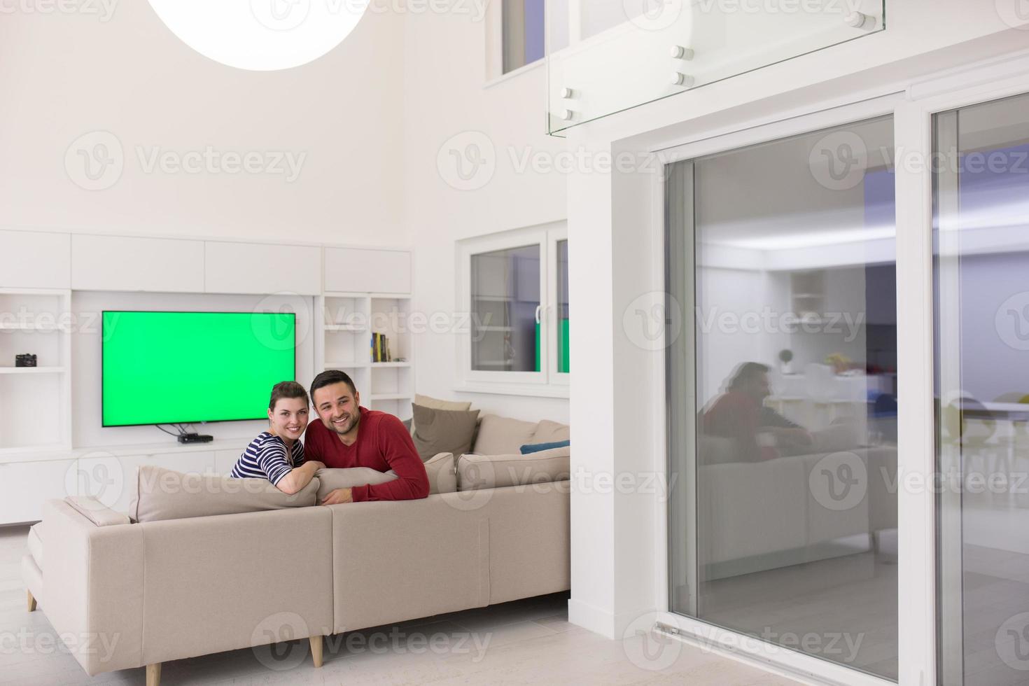 couple hugging and relaxing on sofa photo