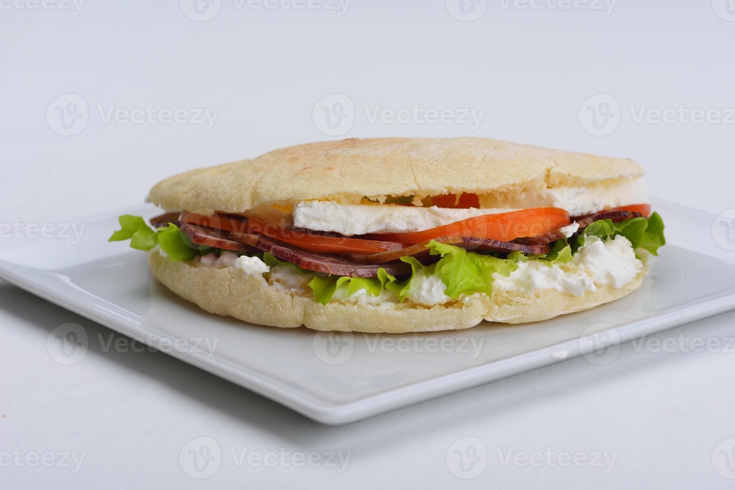 sandwich on a white surface photo