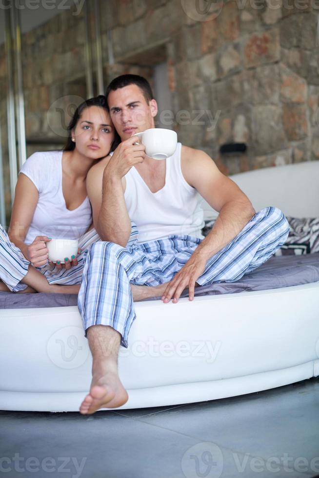 couple relax and have fun in bed photo