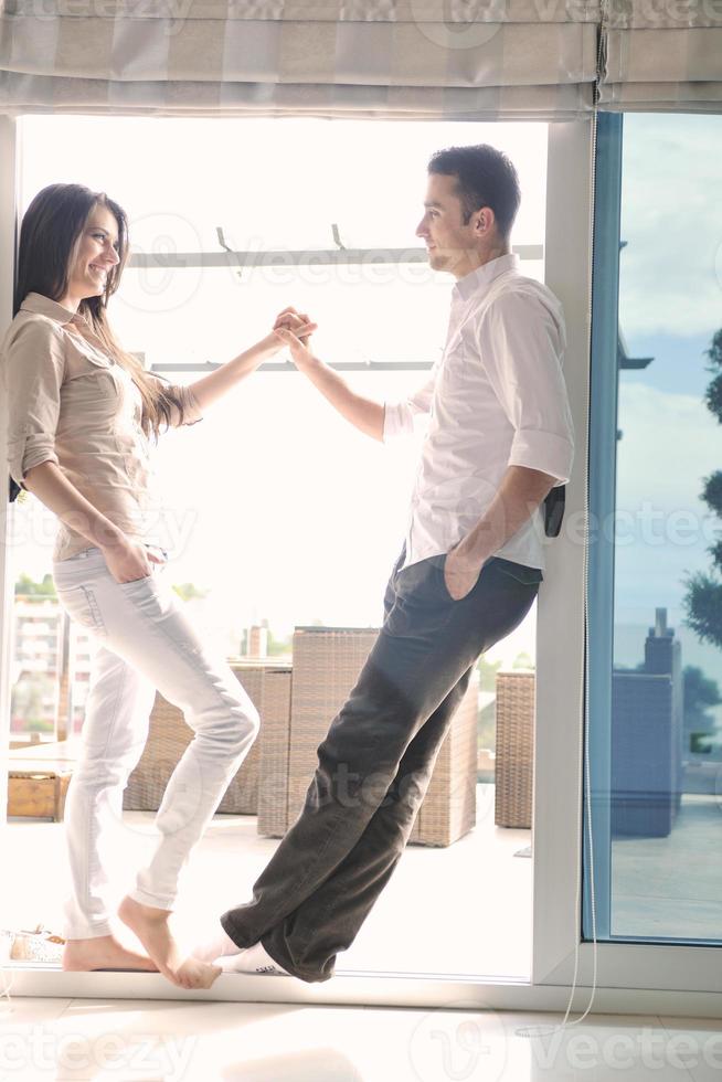 couple relaxing on balcony photo