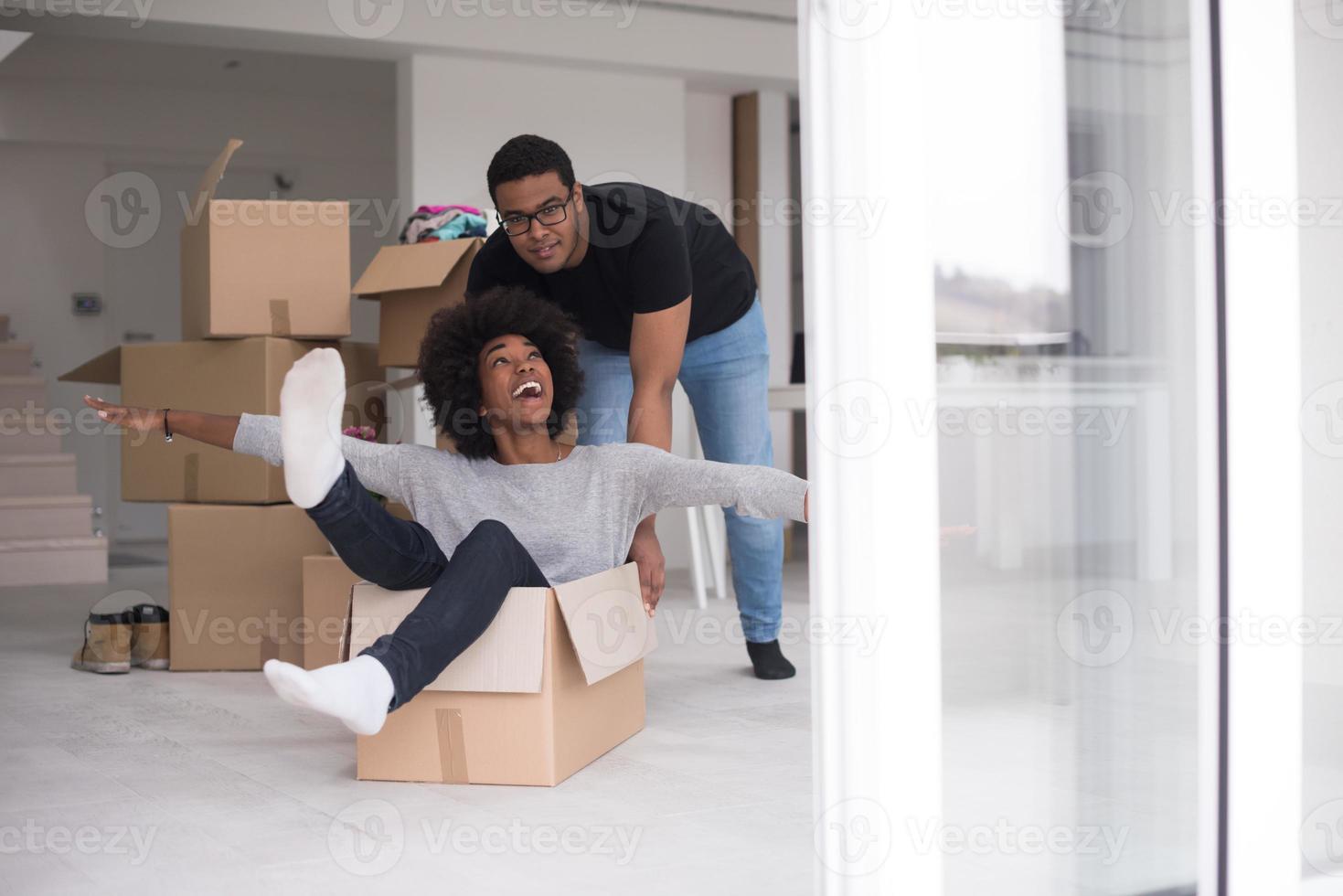 African American couple  playing with packing material photo