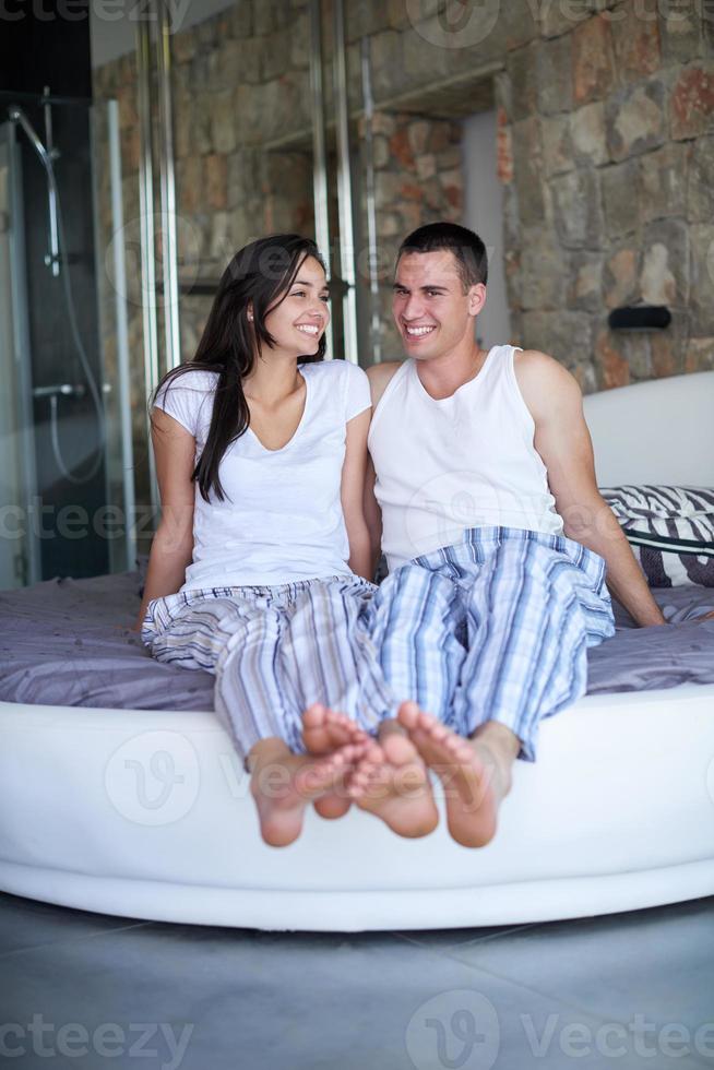 couple relax and have fun in bed photo