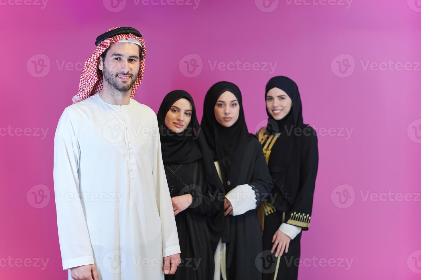 portrait of young muslim people isolated on pink photo
