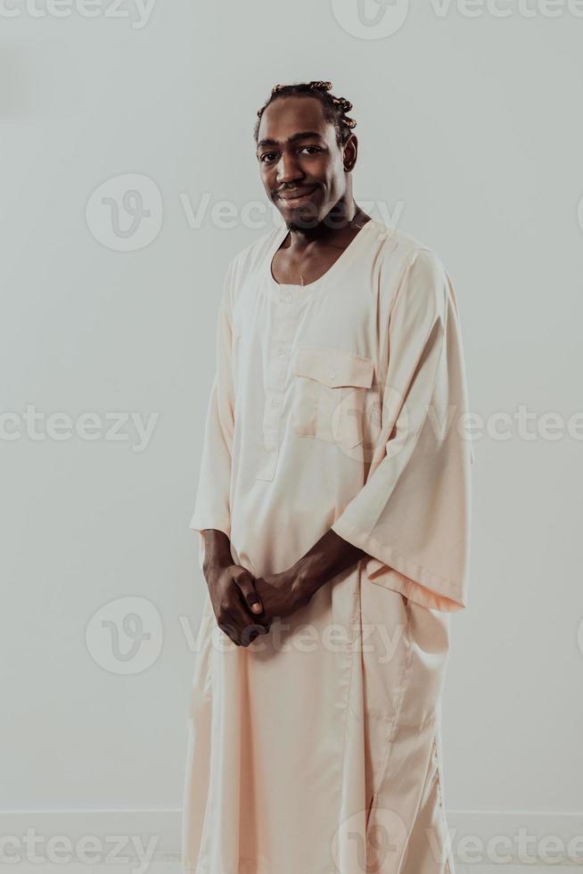 Portrait of handsome african black man in traditional islamin sudan fashion clothes. Selective focus photo