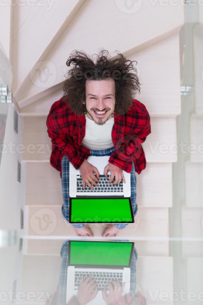 freelancer in bathrobe working from home photo