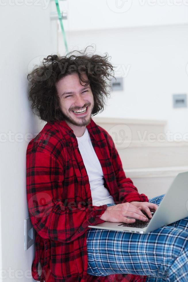 freelancer in bathrobe working from home photo