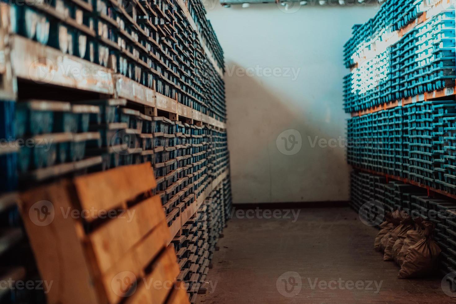 Gold mining storage rock core samples geology drilling industy. Large ore warehouse in modern industry, ores stacked in boxes. Selective focus photo