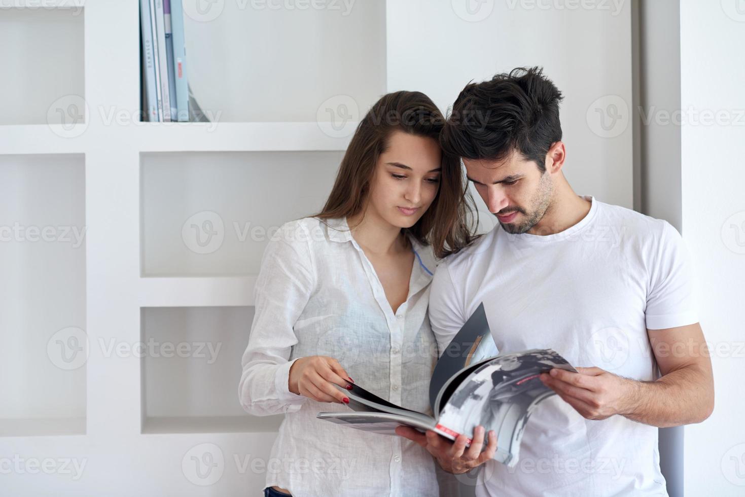 relaxed young couple at home staircase photo
