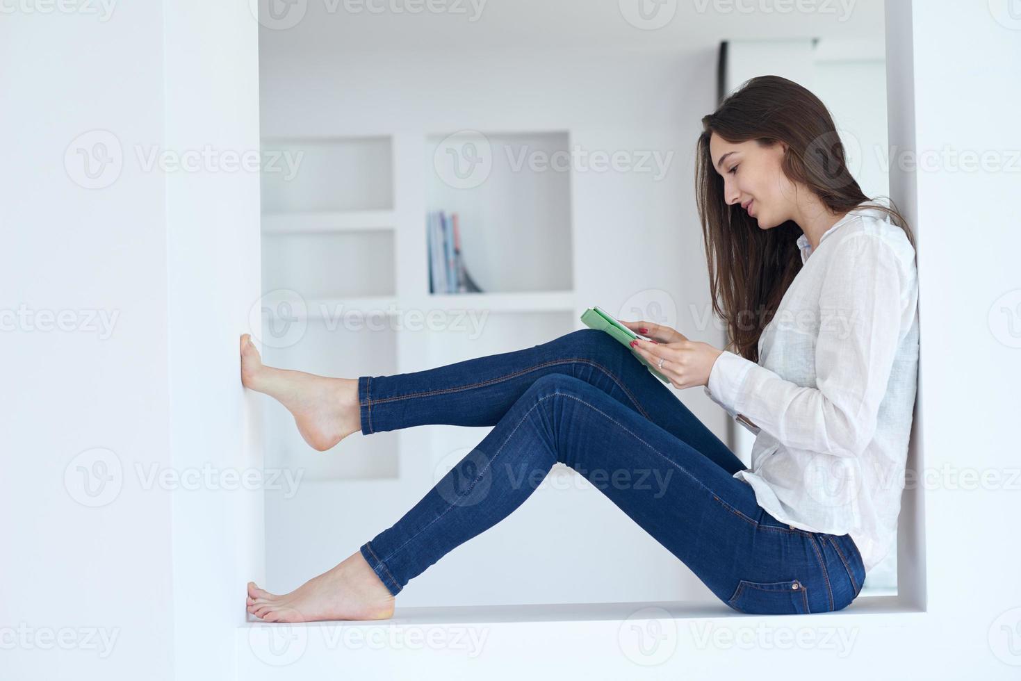 woman at home using tablet photo