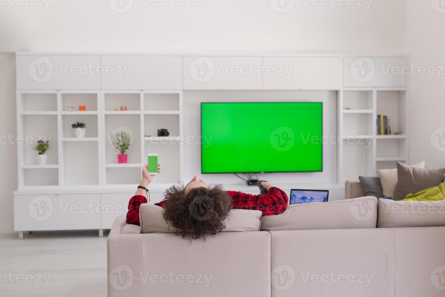 young man in bathrobe enjoying free time photo