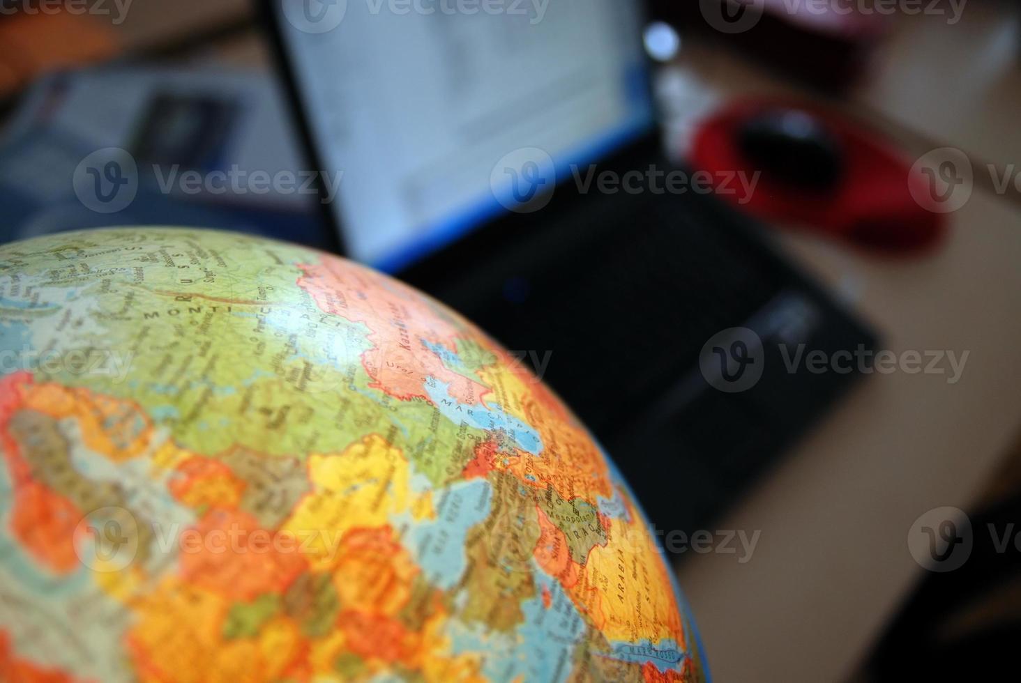 Teamwok concept with hands on globe photo