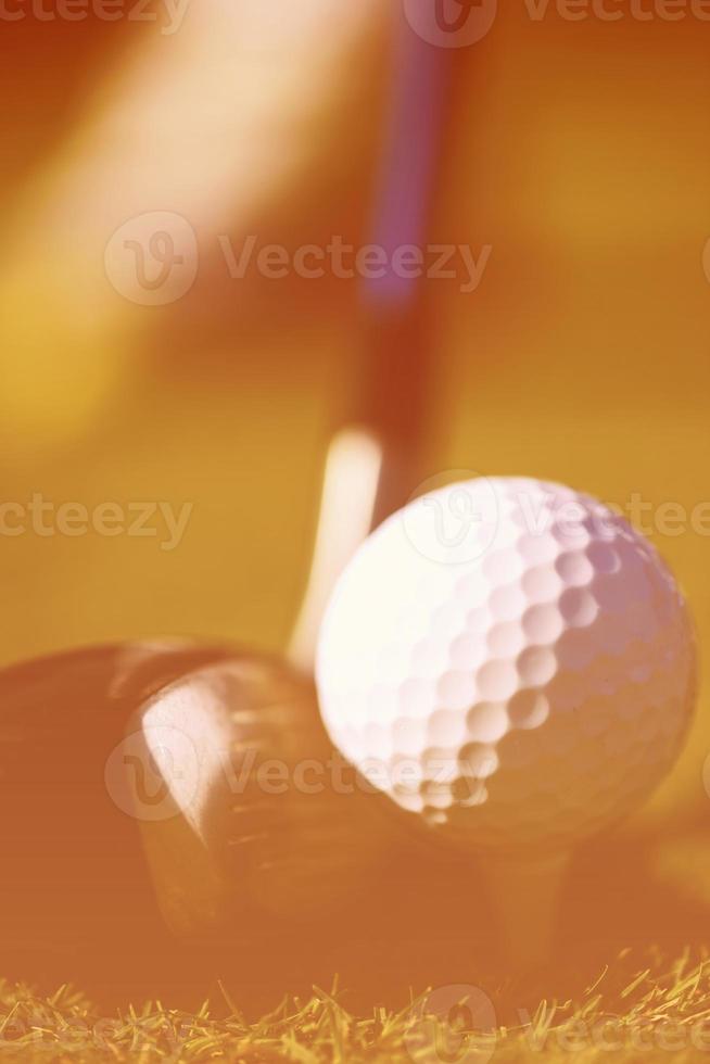 golf club and ball in grass photo