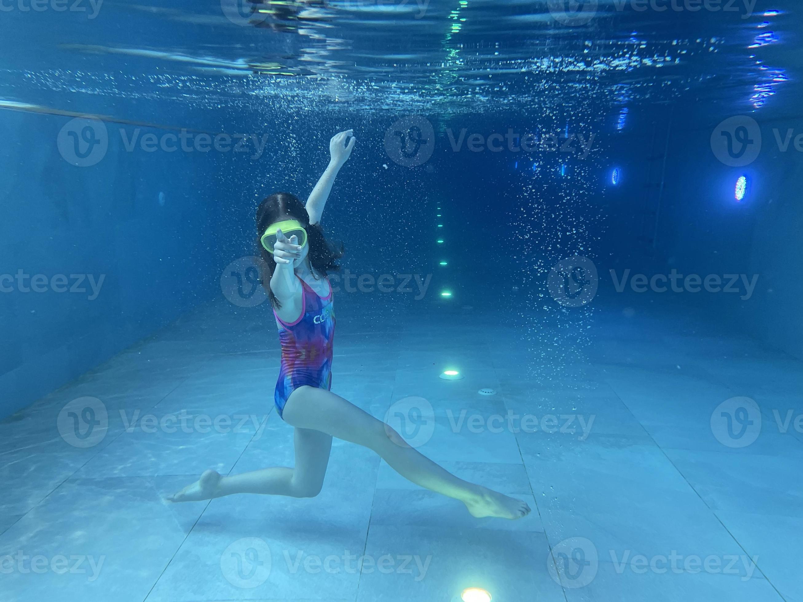 Smiling child in goggles swim, dive in the pool with fun - jump deep down  underwater. Healthy lifestyle, people water sport activity on summers.  10963602 Stock Photo at Vecteezy