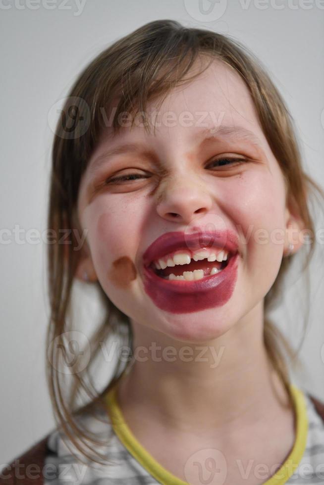 Little girl playing with mommy's make up photo