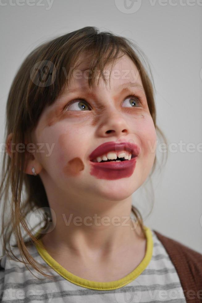 Little girl playing with mommy's make up photo