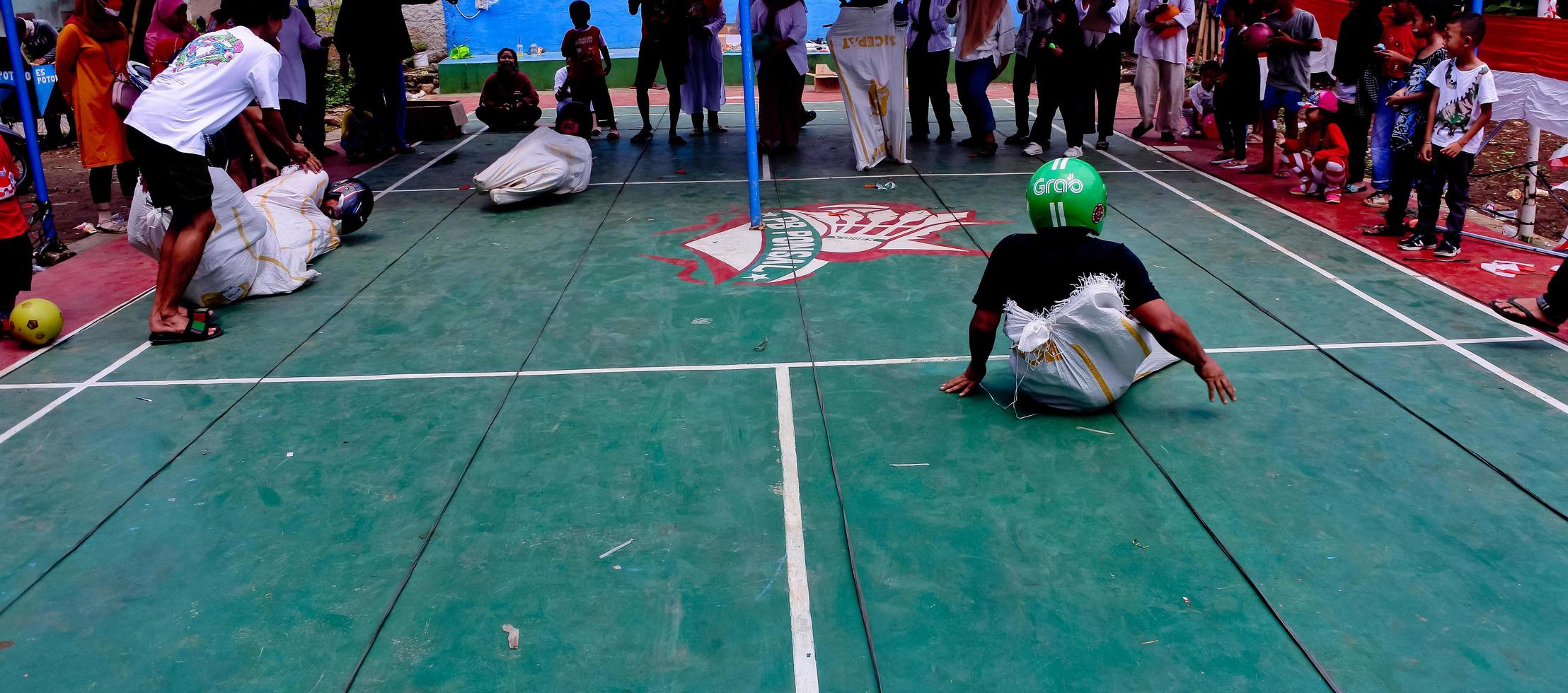 Various competitions to commemorate Indonesia's independence day were carried out in a simple but still lively manner. Sack race, cracker eating competition, tug of war, areca climbing competition. photo