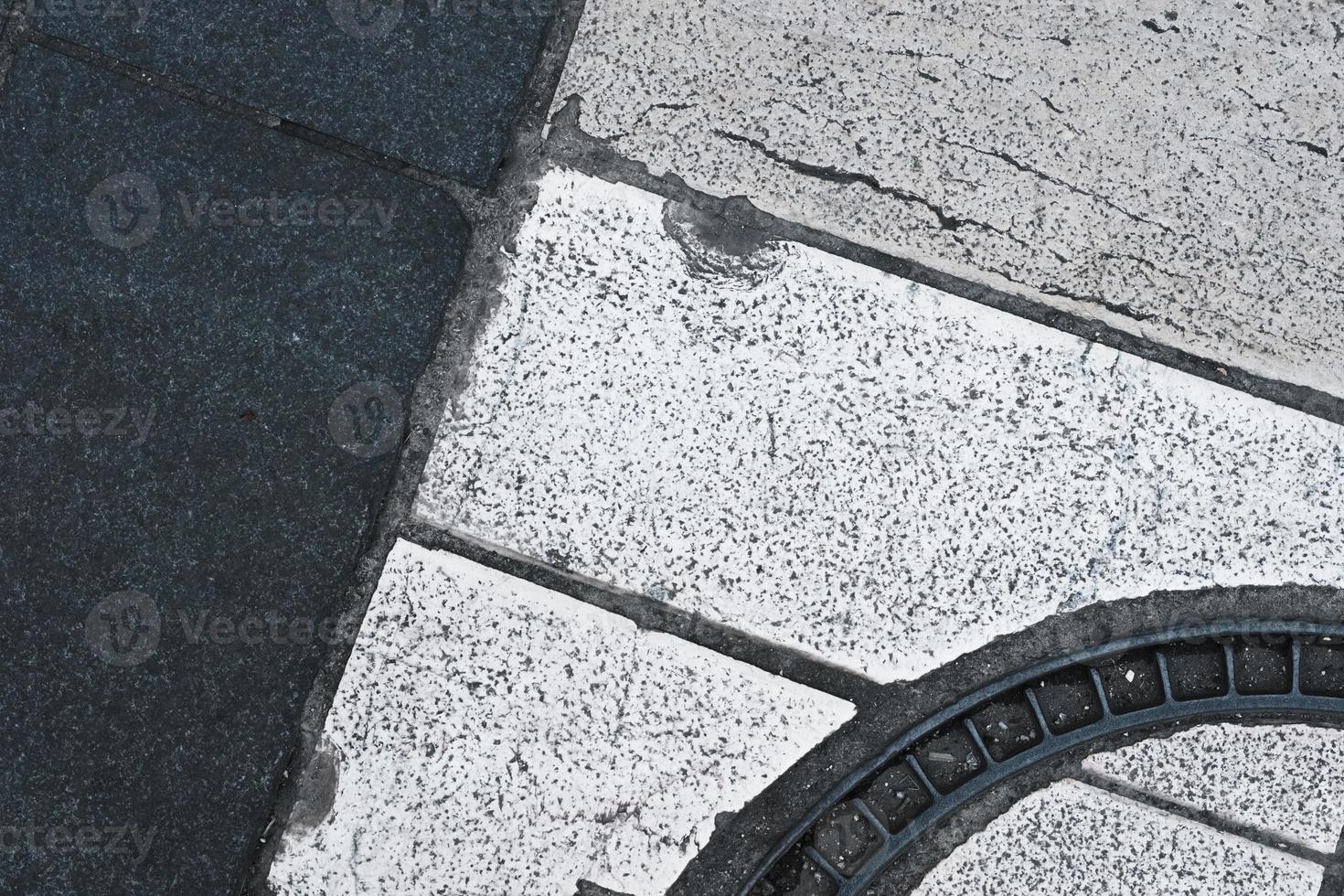 White and dark lines of crossing in the city, closeup, road texture and pattern, grunge pavement background, textured street ground surface. photo