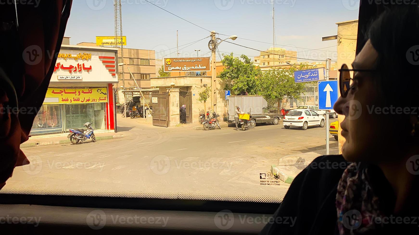 Tehran, Iran, 2022 - tourist in bus passenger point of view to city traffic in countryside of Iran when travel to Isfahan photo