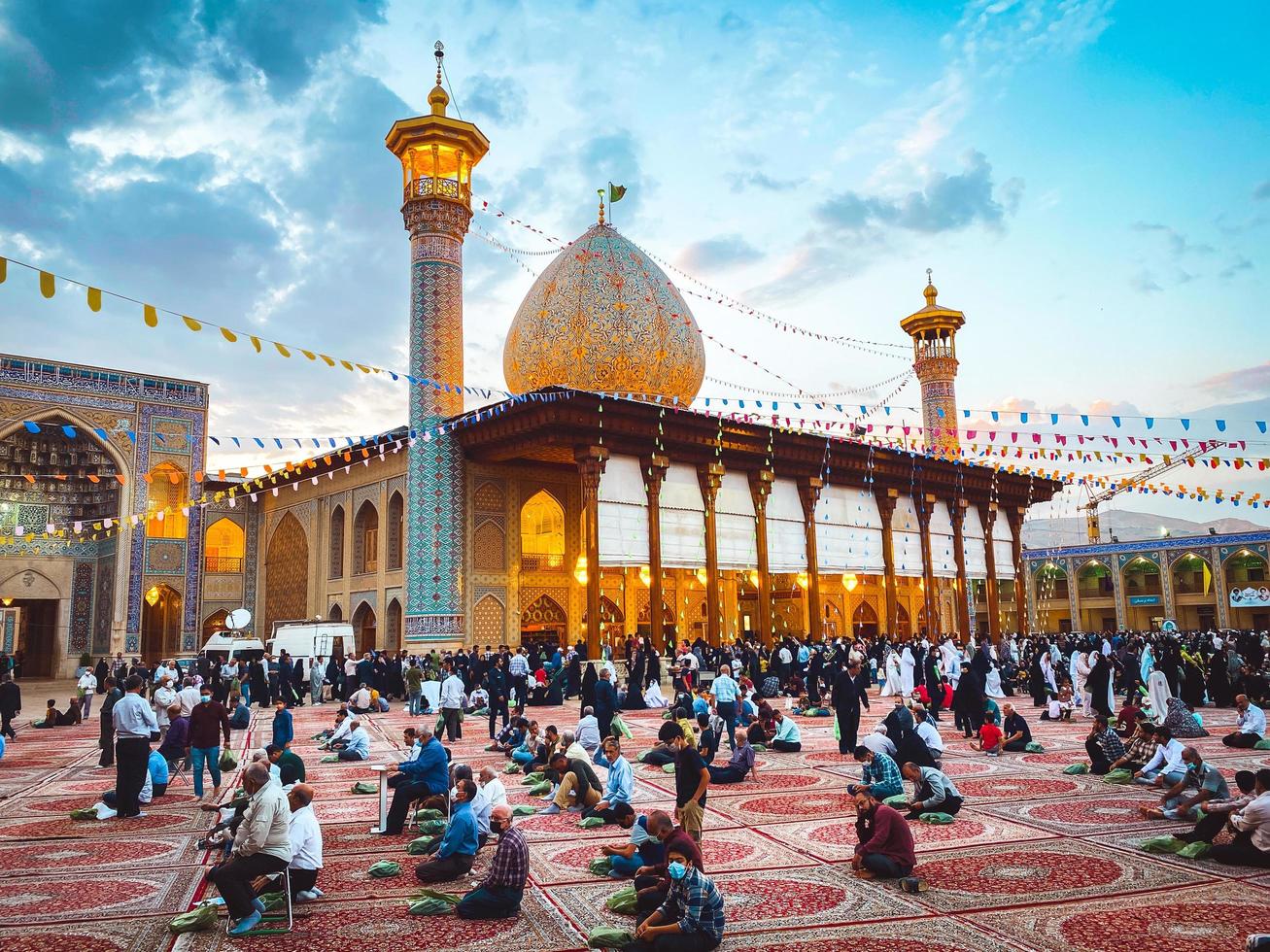 Shiraz, Iran,  2022 - muslim men pray on ceremonial event in Shahcheragh holy shrine photo