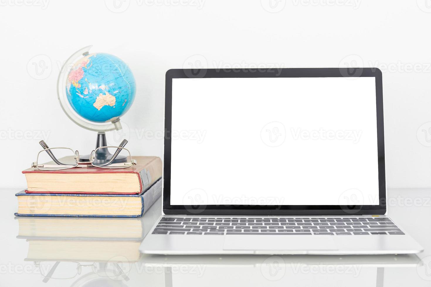 Laptop mockup with blank screen on table photo