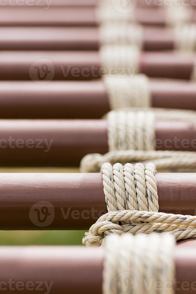 Rope knot around metal pipe photo