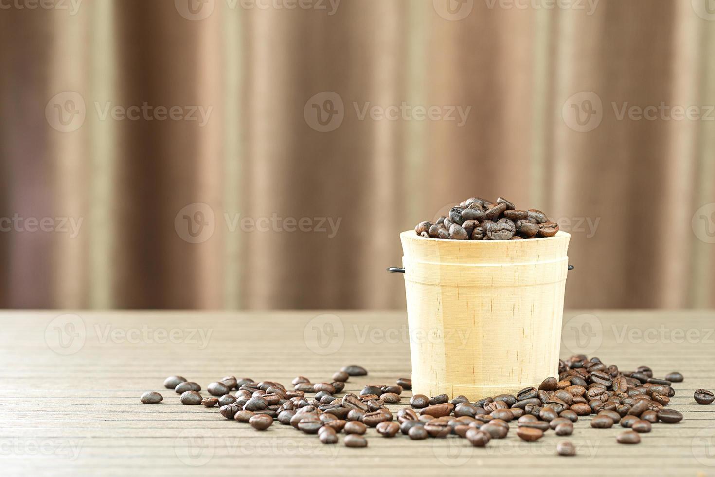 Coffee beans in wood bucket photo
