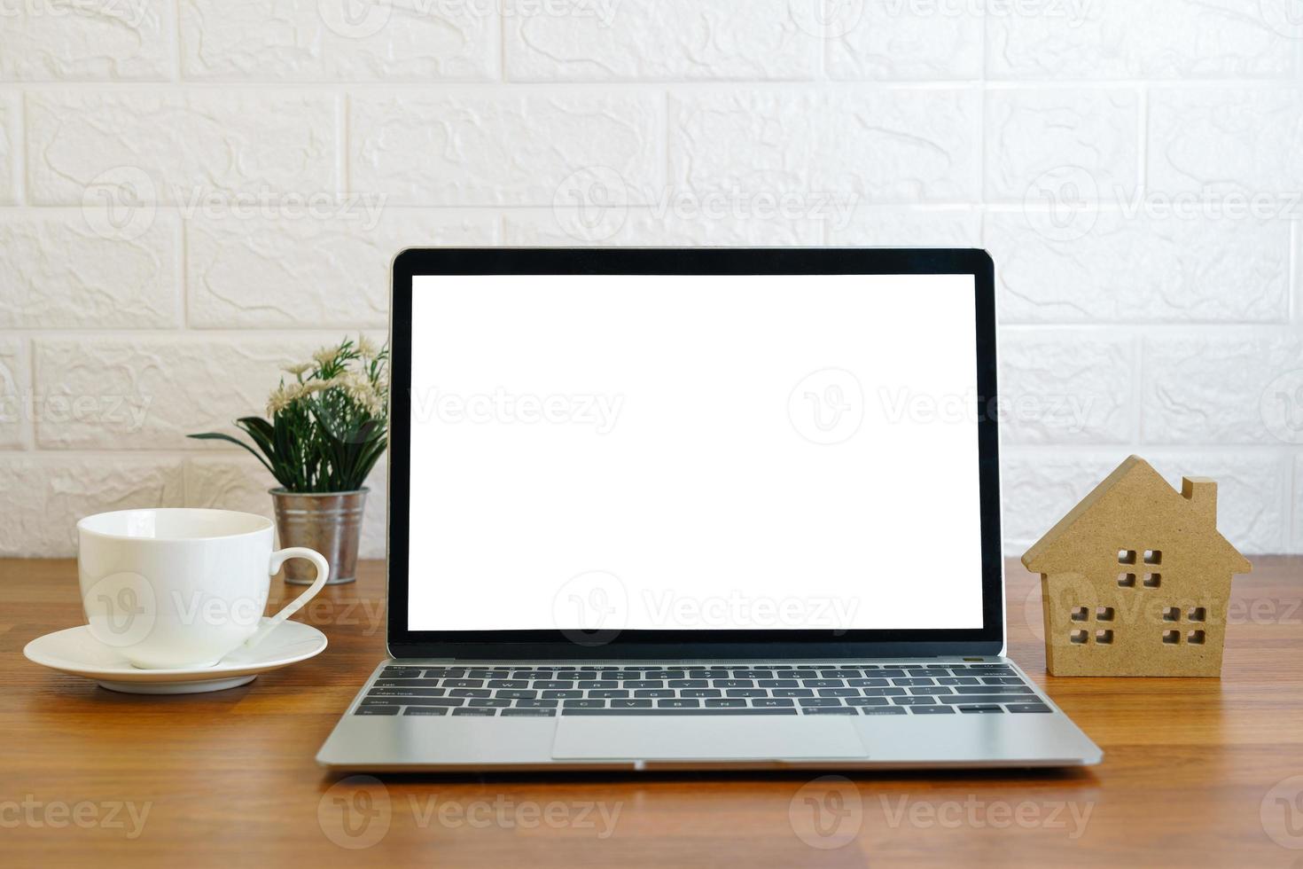 Workplace with laptop on table at home photo
